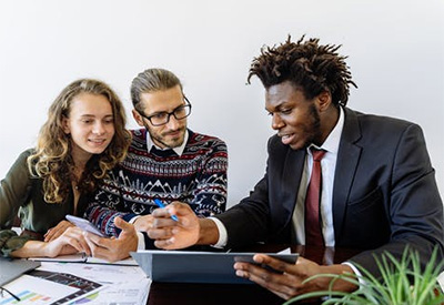 Students working with financial coach