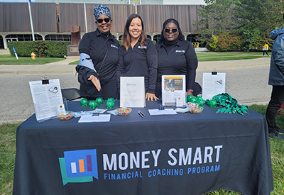 Mott community college recruitment table with Gail, Amber and Maria